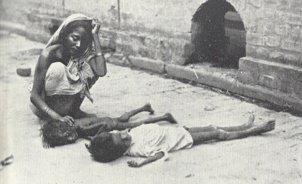 Mother is mourning over her dead children. The effect of food scarcity in Bengal.